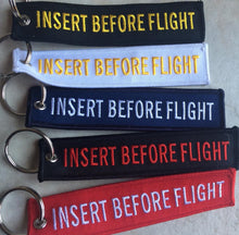 Insert Before Flight Keychain