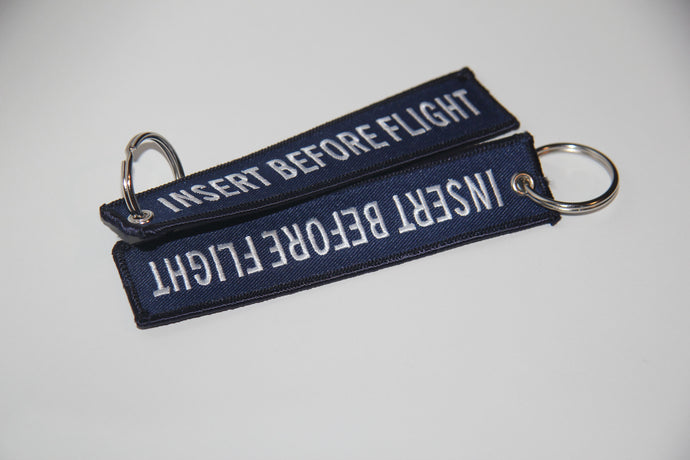 Insert Before Flight Keychain